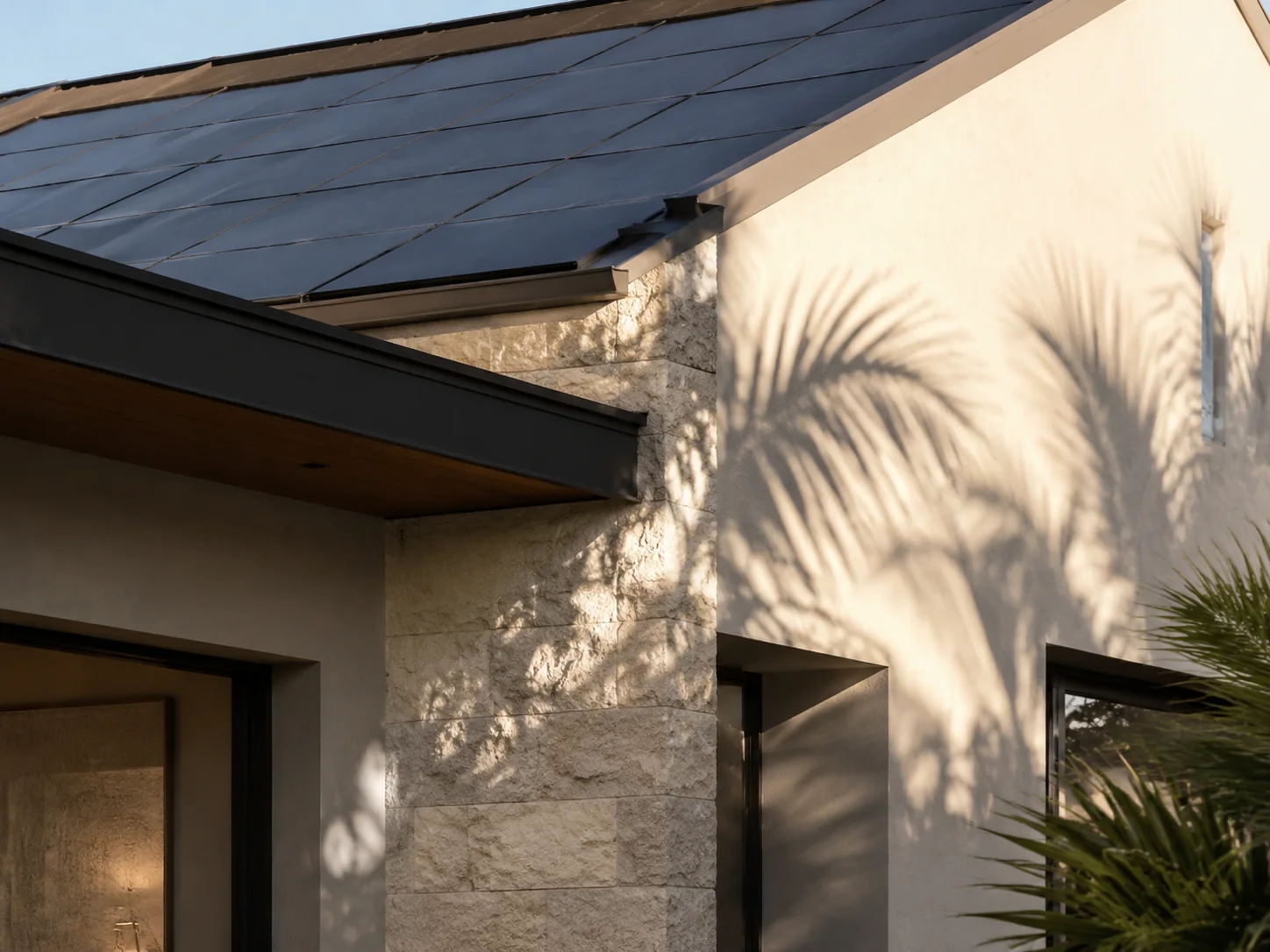 Architectural detail of a Florida home with integrated solar and palm shadows